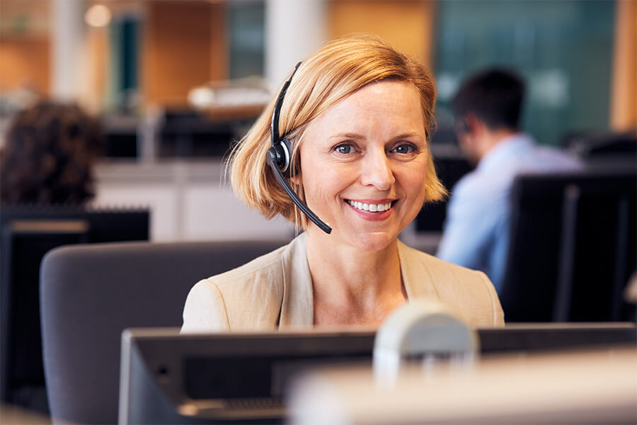 Female caucasian worker with headset